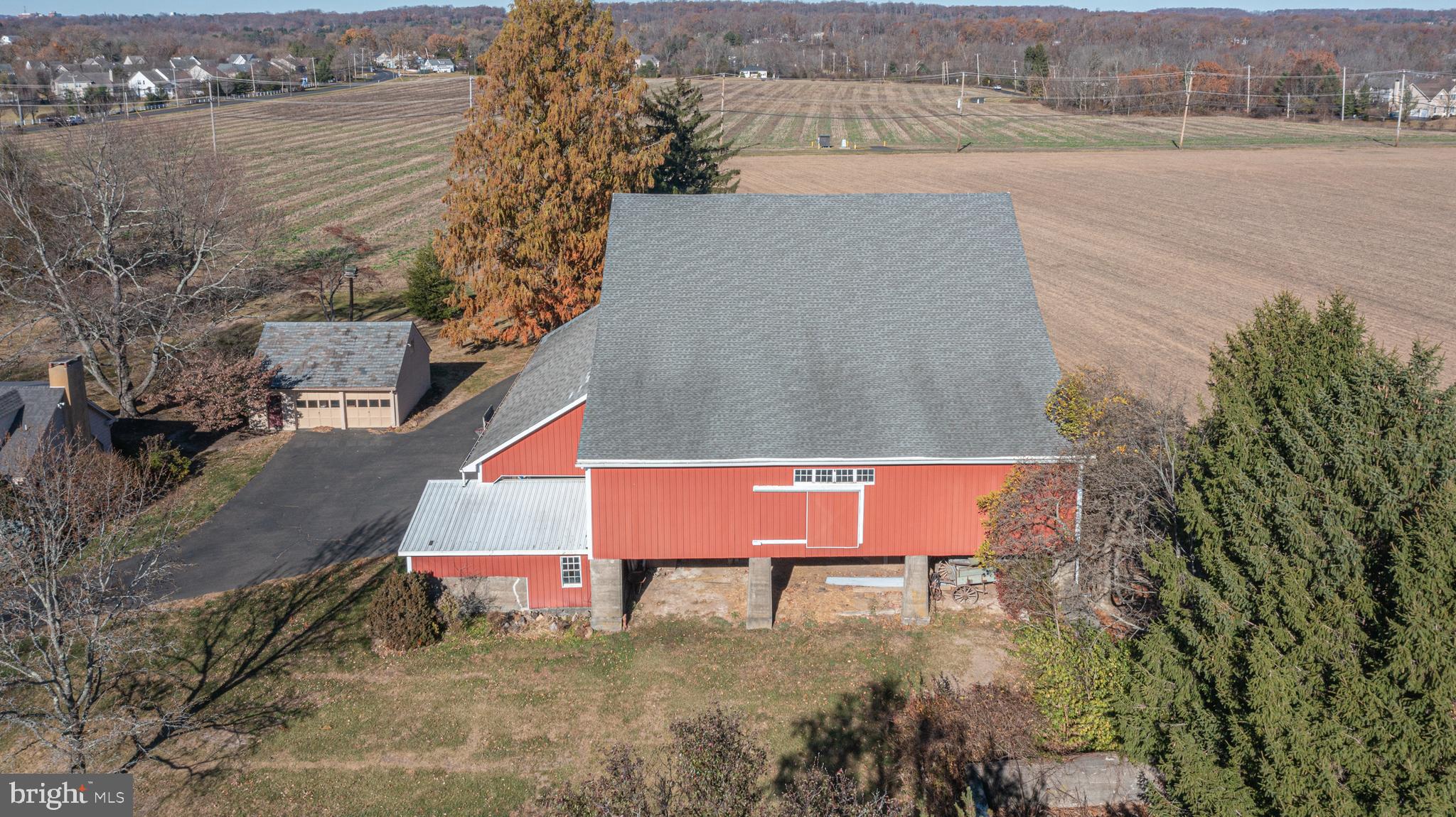 2209 Swamp Road Furlong, PA 18925 - Photo 7 of 59 an aerial view of a house with a yard and lake view