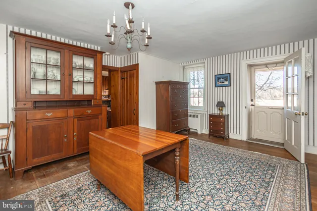a kitchen with stainless steel appliances kitchen island granite countertop a refrigerator and a sink
