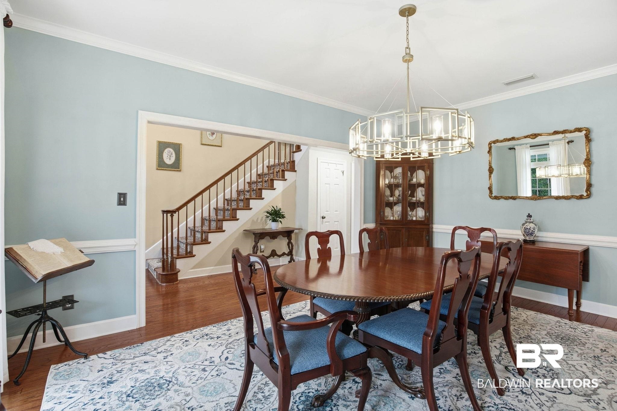 31515 Rhett Drive Spanish Fort, AL 36527 - Photo 14 of 100 The dining room measures 13' 1" x 16' 7" and has crown molding, lots of natural light and a beautiful chandelier.