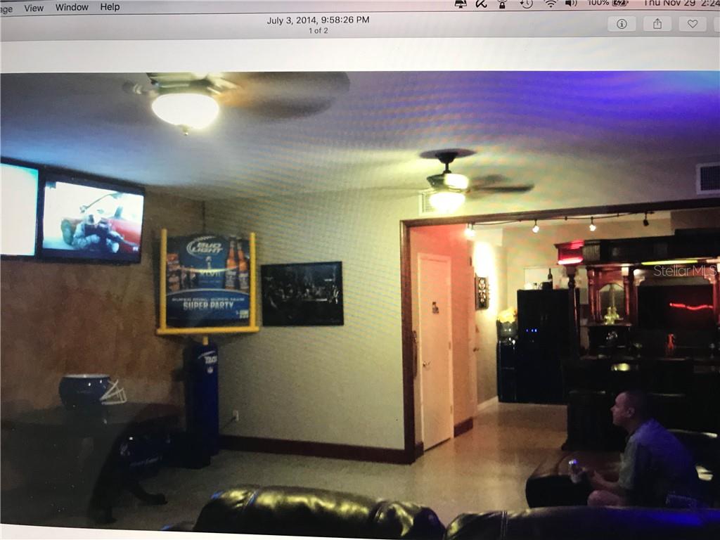 Undisclosed Address St. Pete Beach, FL 33706 - Photo 4 of 5 a view of a living room with washer and dryer
