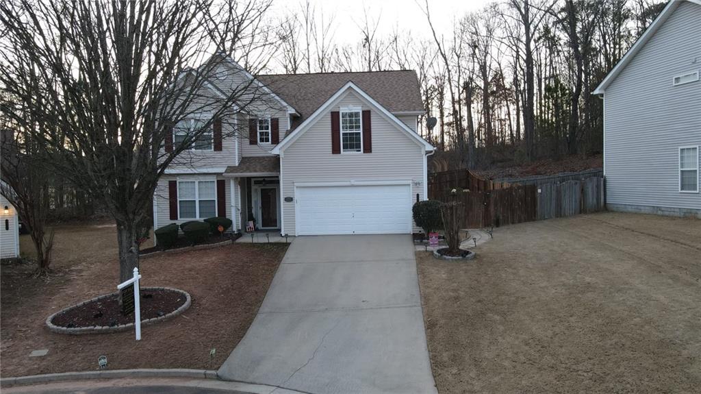 4475 Feather Way Douglasville, GA 30135 - Photo 1 of 1 a view of house and yard with trees