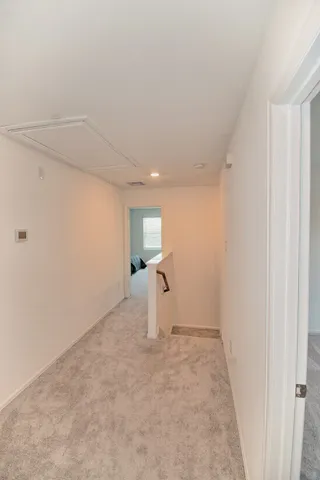 a view of a room with stairs and a window