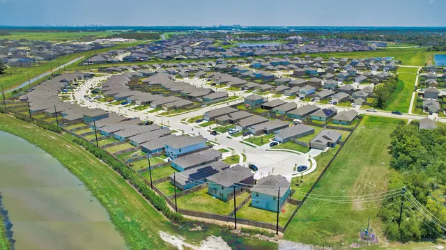 an aerial view of residential houses with outdoor space
