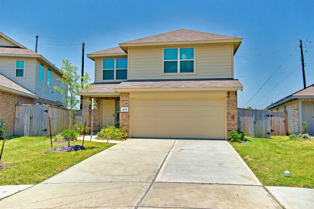 a front view of house with yard