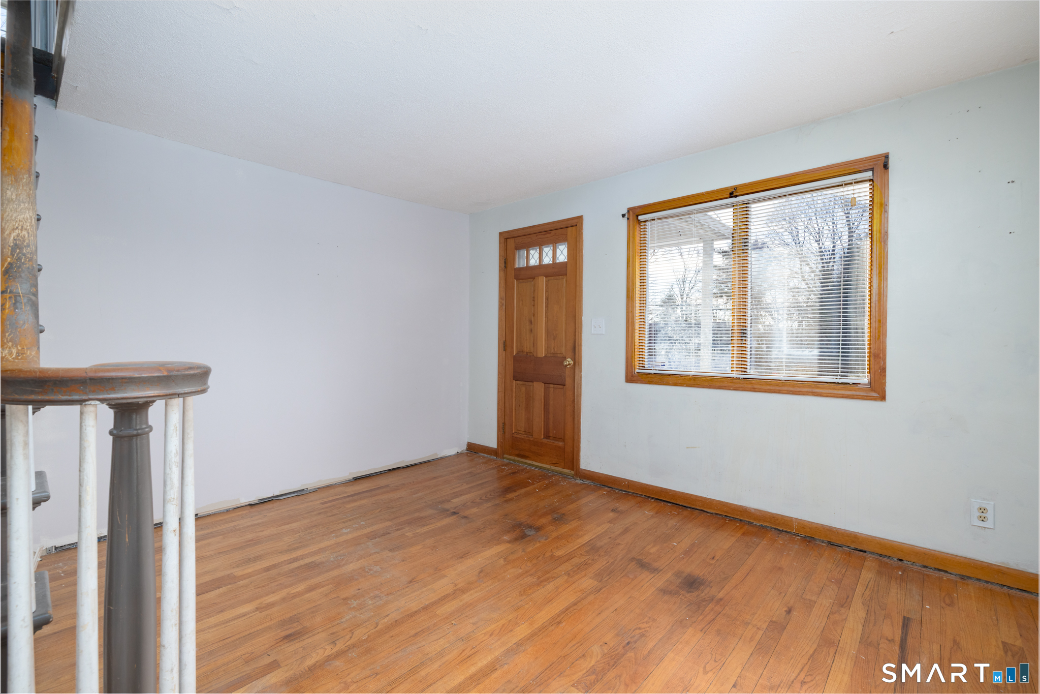 3 Sandra Street Bristol, CT 06010 - Photo 12 of 31 a view of an empty room with wooden floor and a window