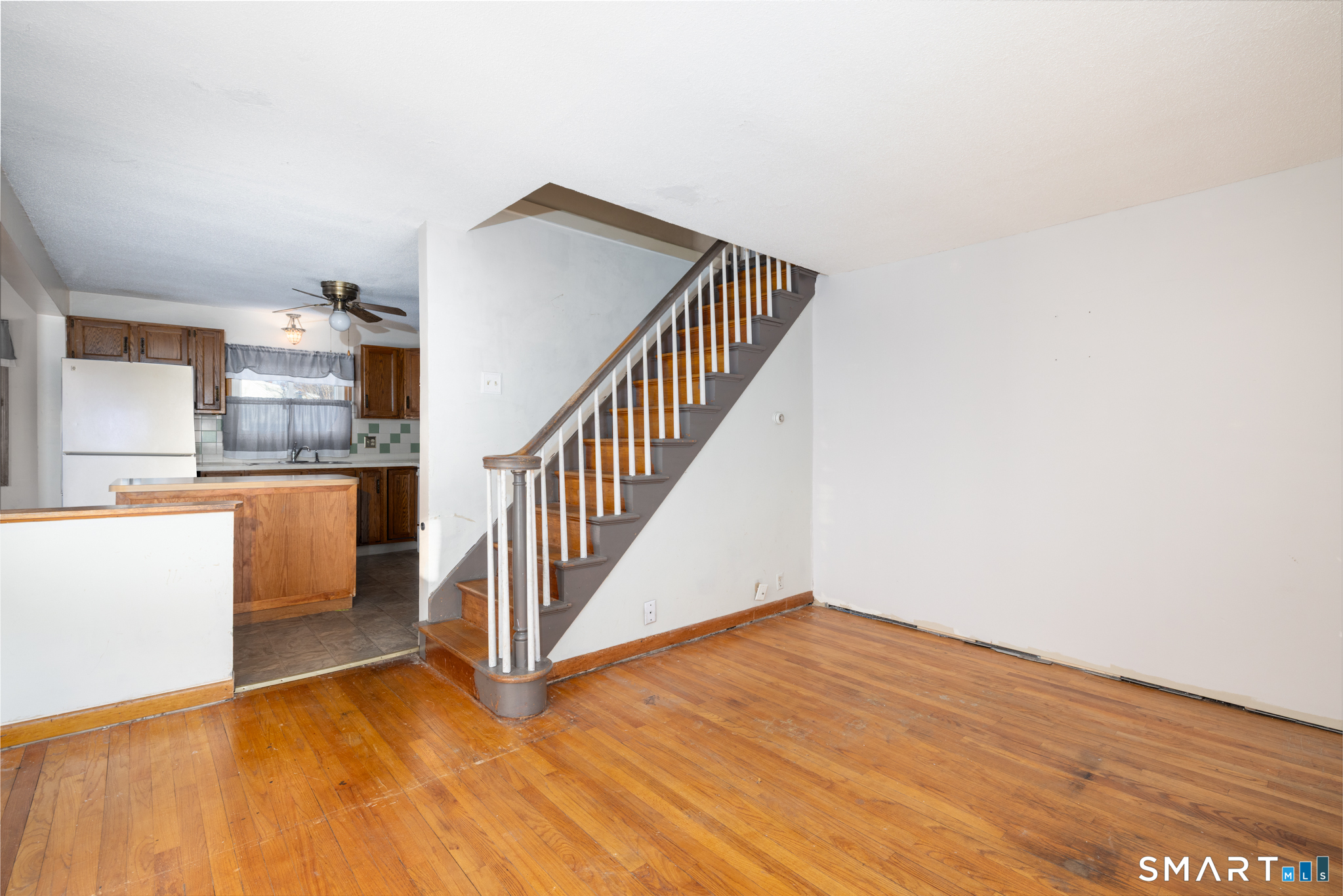 3 Sandra Street Bristol, CT 06010 - Photo 13 of 31 a view of a kitchen with wooden floor and electronic appliances