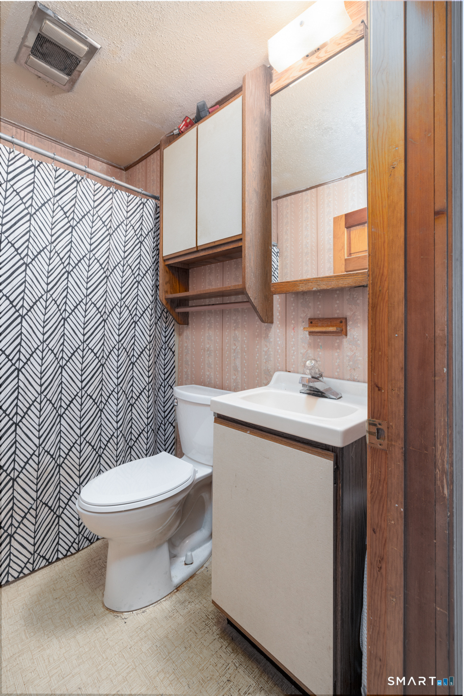 3 Sandra Street Bristol, CT 06010 - Photo 15 of 31 a bathroom with a sink toilet and mirror