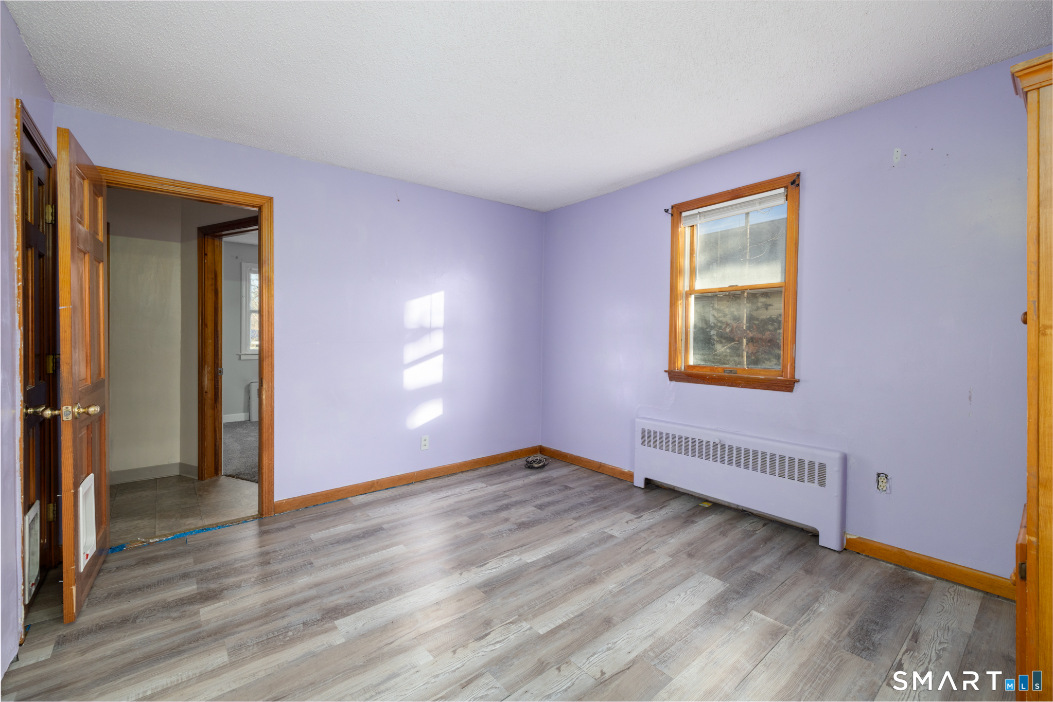 3 Sandra Street Bristol, CT 06010 - Photo 19 of 31 a view of an empty room with wooden floor and a window
