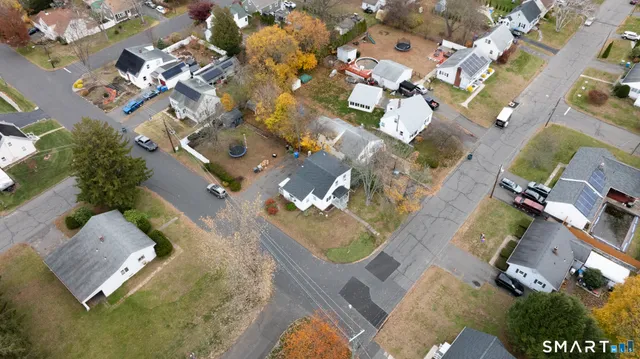 an aerial view of residential houses with outdoor space