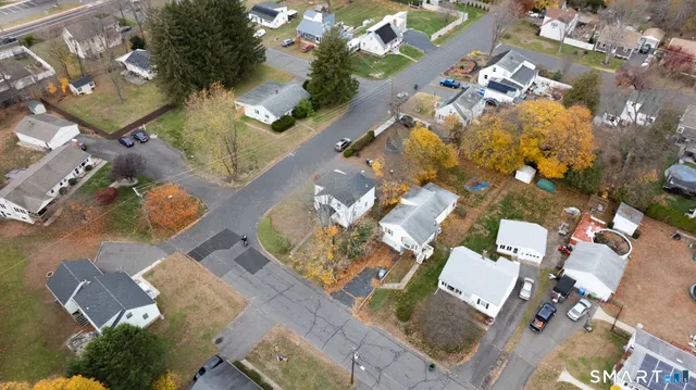 an aerial view of a house with a swimming pool