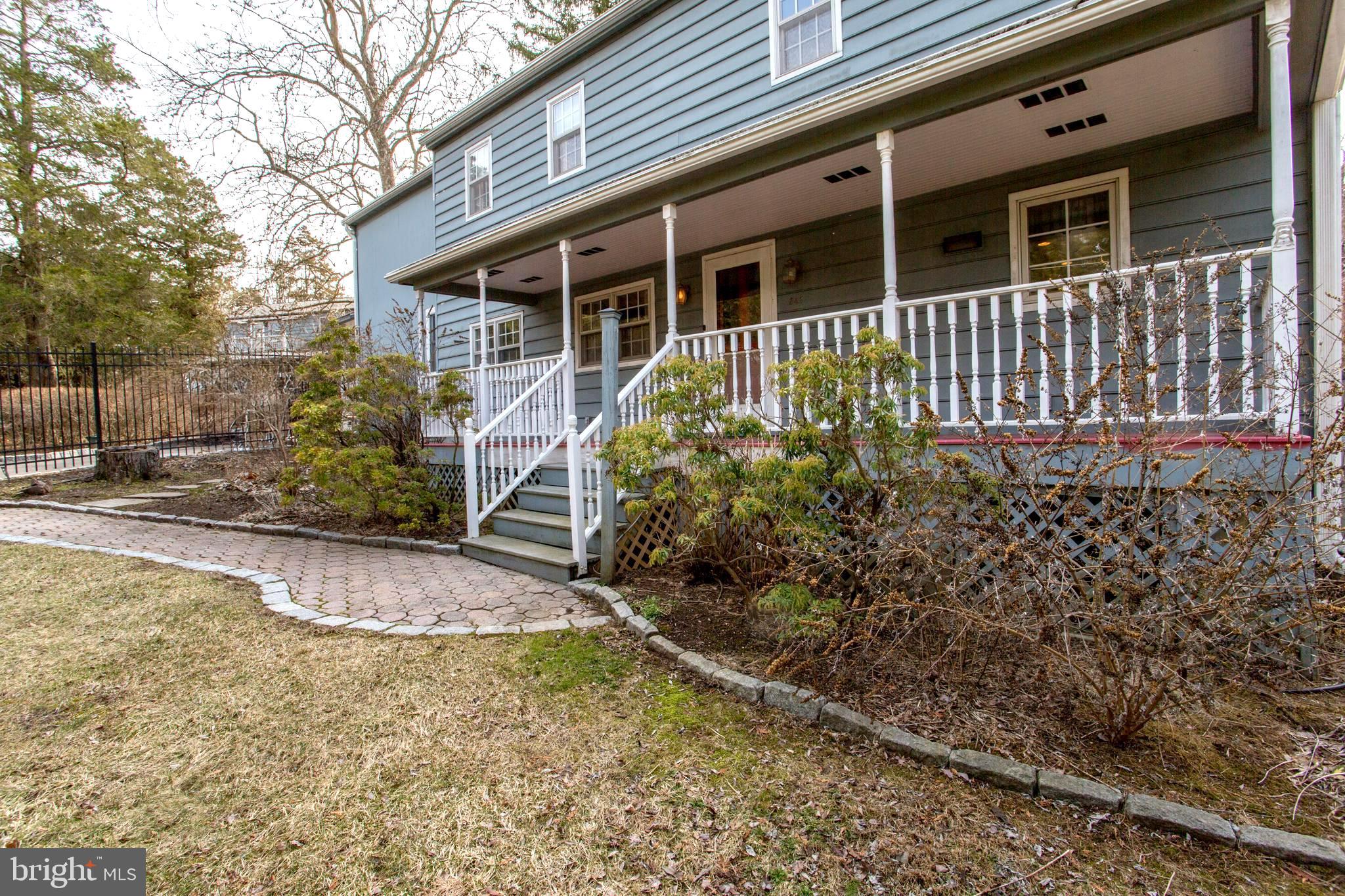 242 South Sugan Road New Hope, PA 18938 - Photo 1 of 35 a front view of a house with a yard