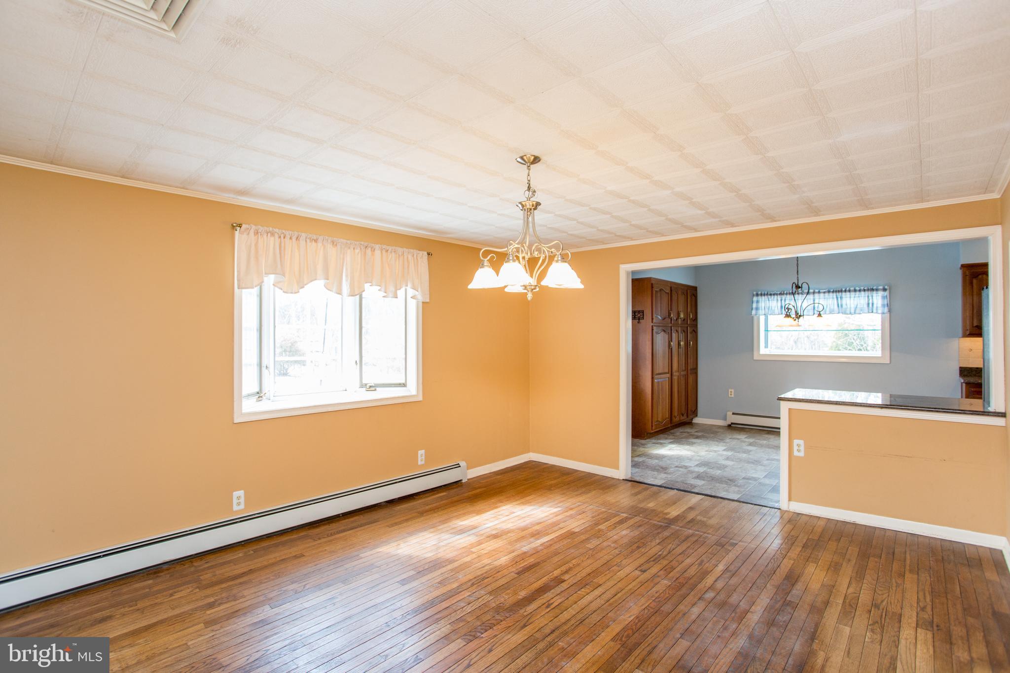 242 South Sugan Road New Hope, PA 18938 - Photo 18 of 35 an empty room with wooden floor and windows