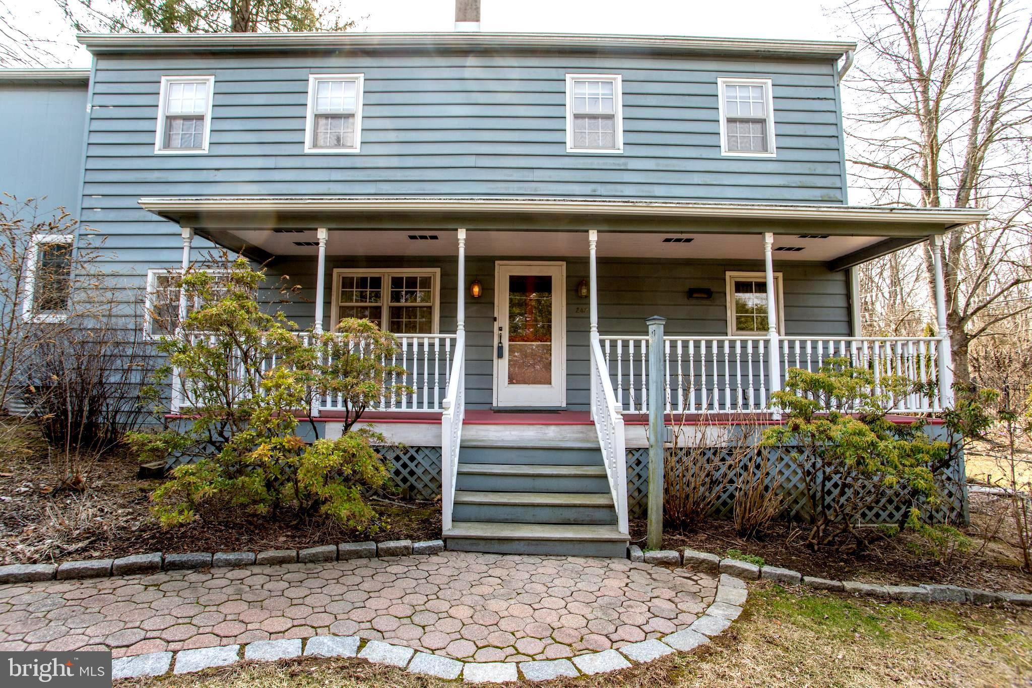 242 South Sugan Road New Hope, PA 18938 - Photo 2 of 35 a front view of a house with a garden