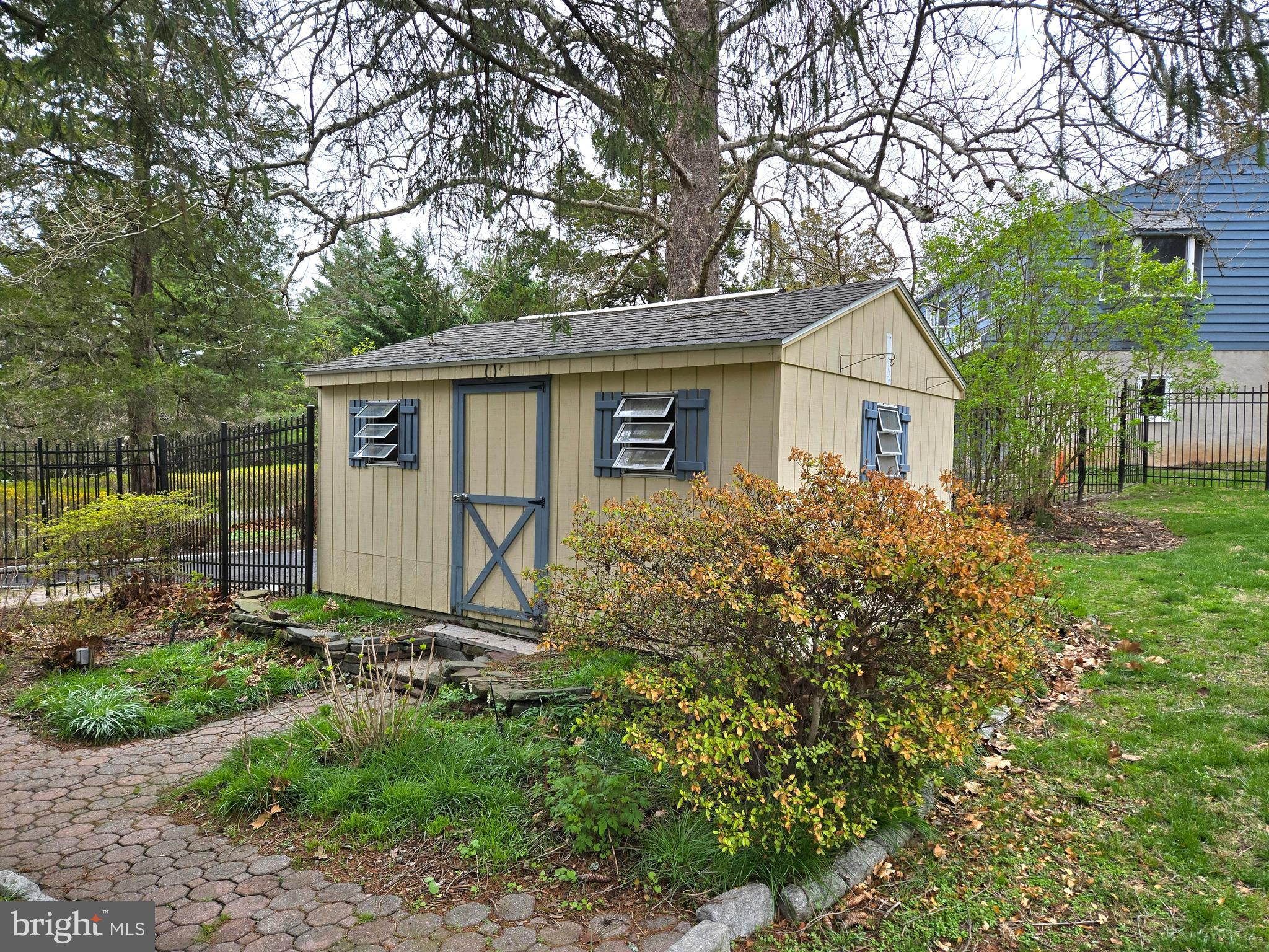 242 South Sugan Road New Hope, PA 18938 - Photo 32 of 35 a view of a backyard with plants and large tree