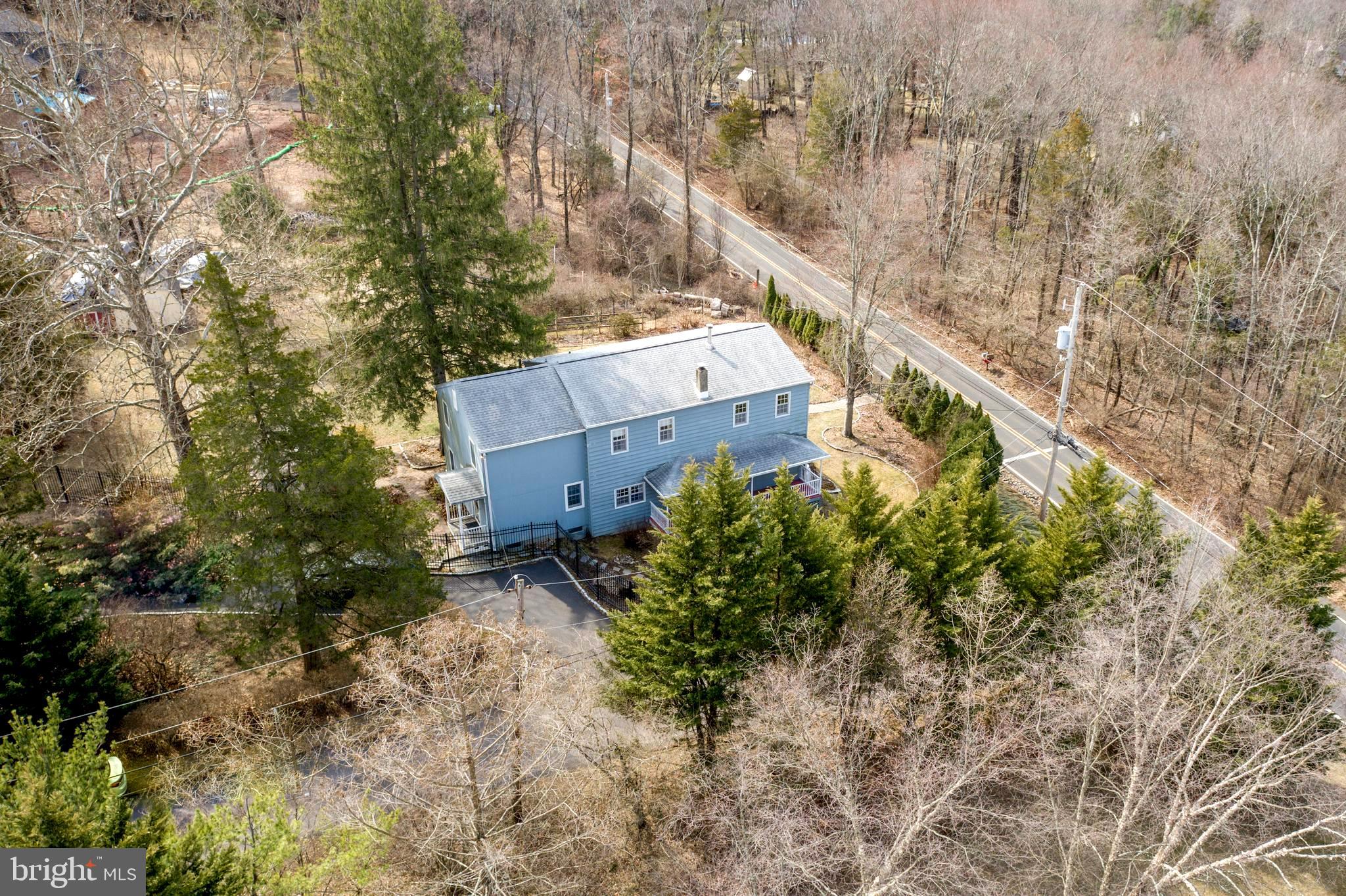 242 South Sugan Road New Hope, PA 18938 - Photo 33 of 35 a view of a house with a yard and trees