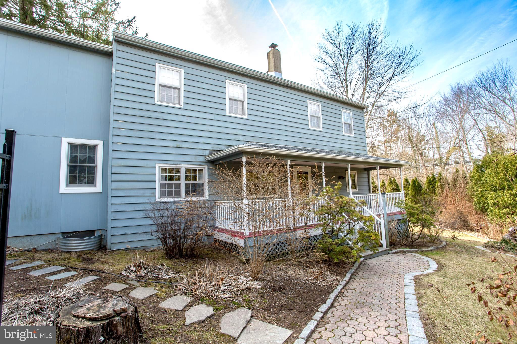 242 South Sugan Road New Hope, PA 18938 - Photo 35 of 35 a front view of a house with garden