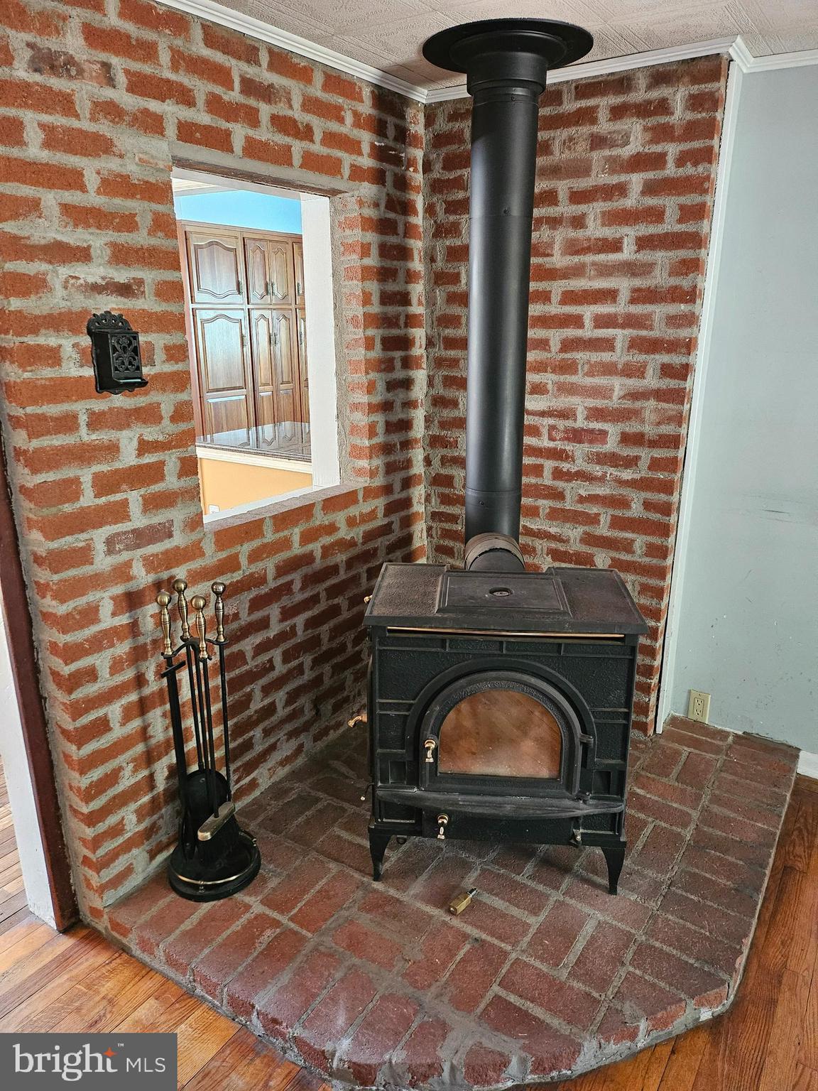 242 South Sugan Road New Hope, PA 18938 - Photo 8 of 35 a room with fireplace and wooden floor