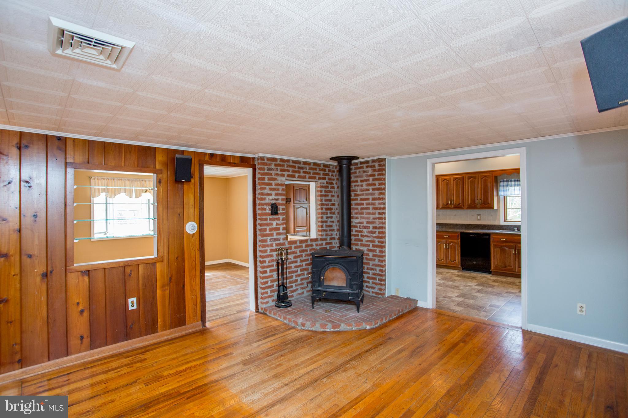242 South Sugan Road New Hope, PA 18938 - Photo 10 of 35 a view of a livingroom with wooden floor and kitchen space