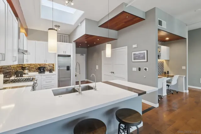 a kitchen with a table and chairs