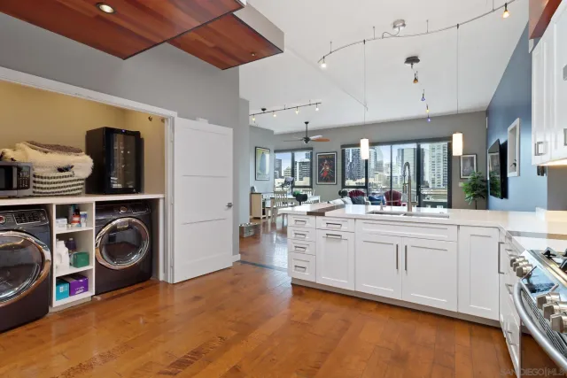 a kitchen with stainless steel appliances granite countertop a stove and cabinets
