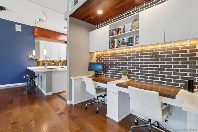 a reading room with furniture and wooden floor