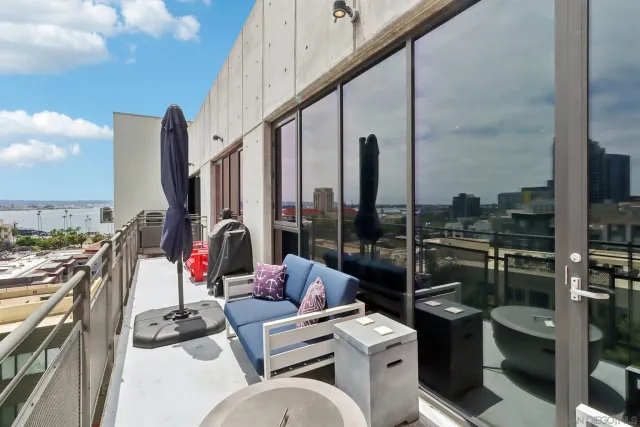 a view of balcony with furniture