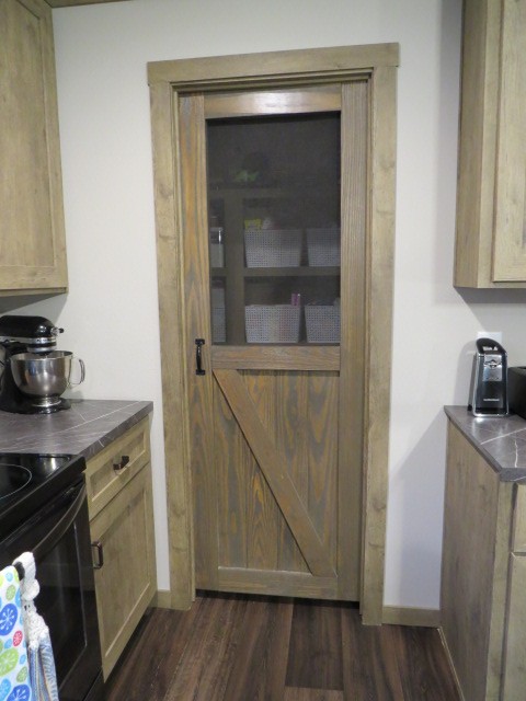 273 Miller Lane Goodspring, TN 38460 - Photo 12 of 42 a kitchen with granite countertop a stove and a wooden floor