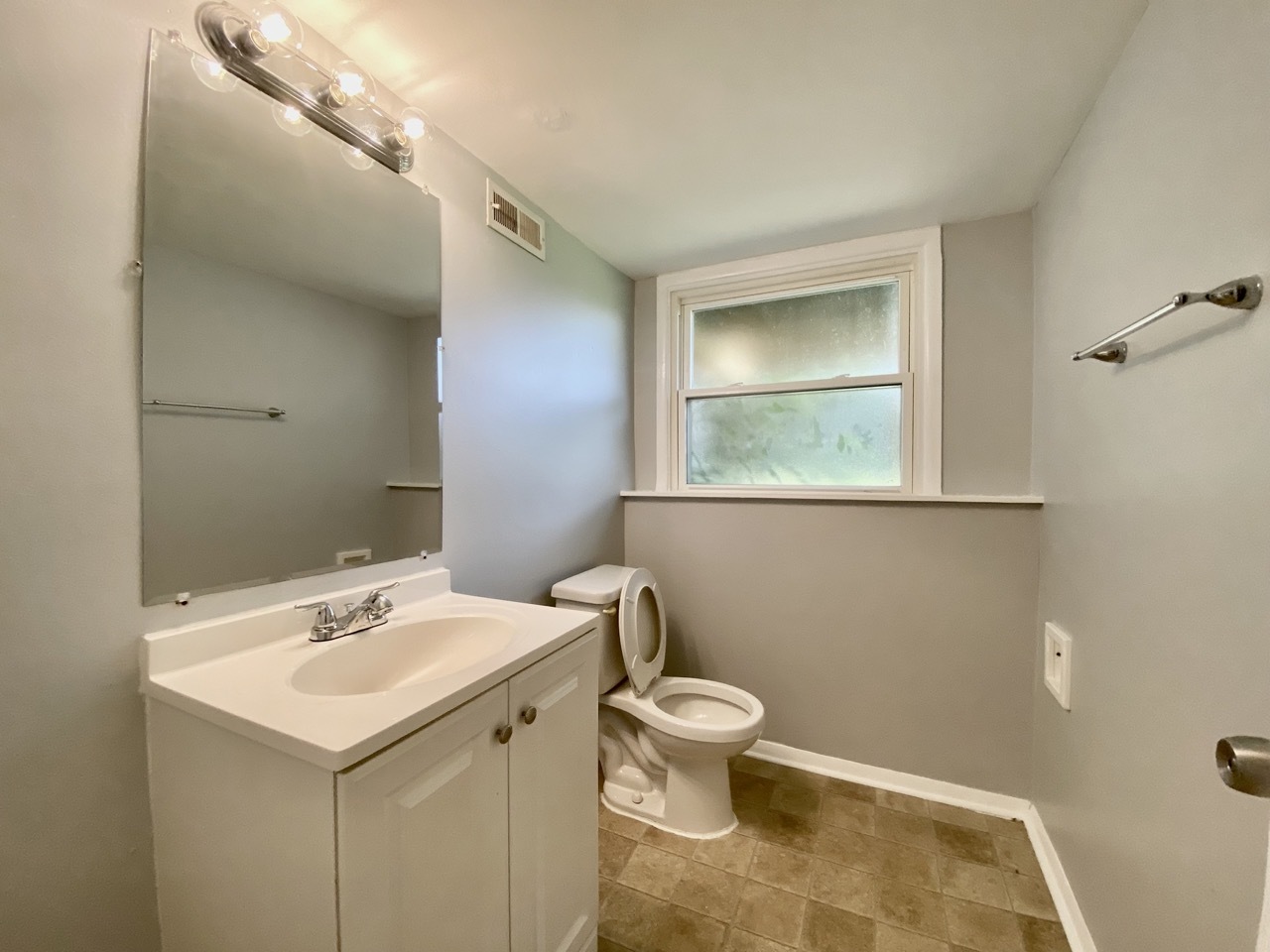 3324 Laurel Lane Hazel Crest, IL 60429 - Photo 20 of 26 a bathroom with a sink mirror vanity and toilet