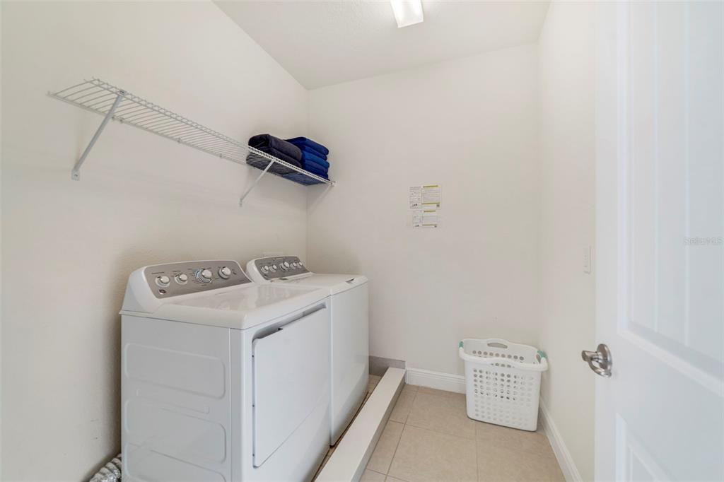 180 Minton Loop Kissimmee, FL 34747 - Photo 41 of 49 a utility room with dryer and washer