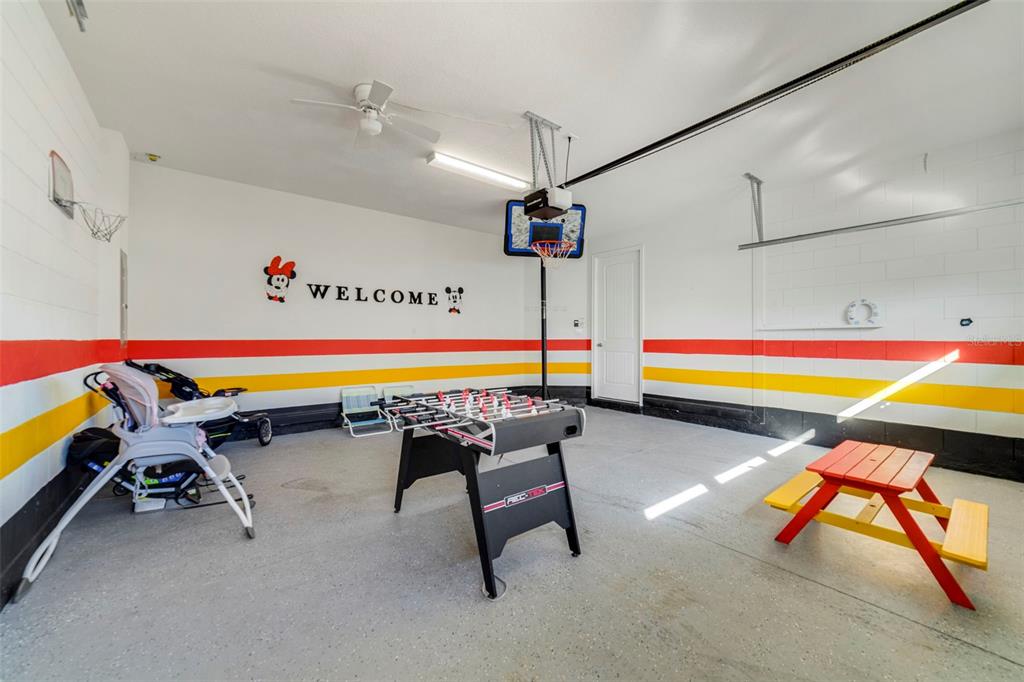 180 Minton Loop Kissimmee, FL 34747 - Photo 42 of 49 a room with musical instruments and air hockey table