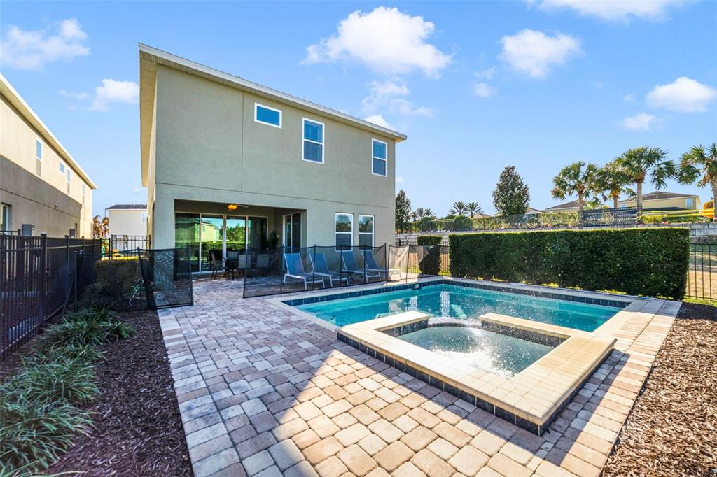 180 Minton Loop Kissimmee, FL 34747 - Photo 46 of 49 a front view of a house with garden