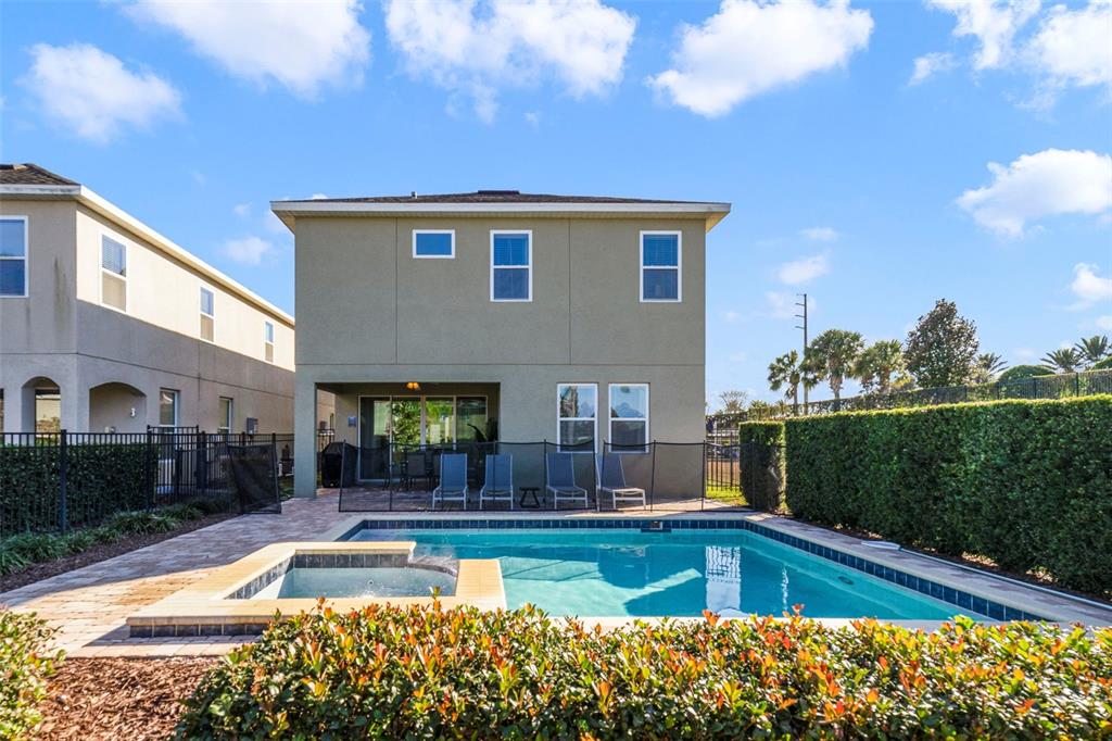 180 Minton Loop Kissimmee, FL 34747 - Photo 47 of 49 a view of house with swimming pool yard and outdoor seating