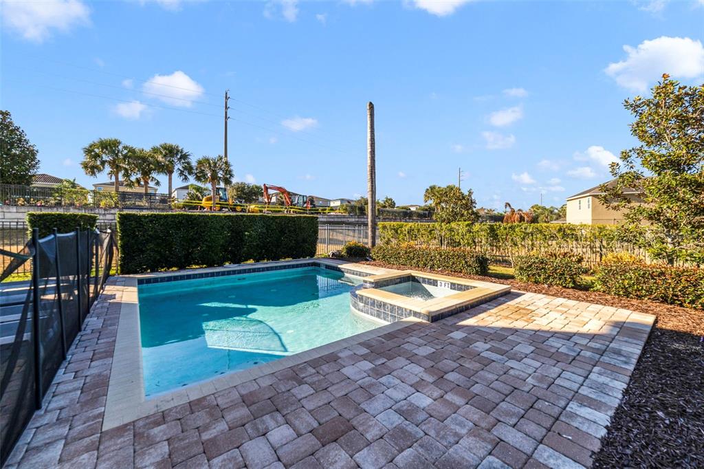 180 Minton Loop Kissimmee, FL 34747 - Photo 49 of 49 a view of a swimming pool and lounge chairs