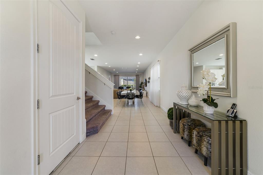 180 Minton Loop Kissimmee, FL 34747 - Photo 8 of 49 a view of a hallway with wooden floor windows and a bathroom