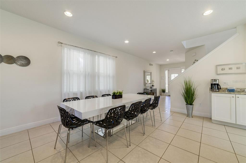 180 Minton Loop Kissimmee, FL 34747 - Photo 10 of 49 a view of a dining room with furniture