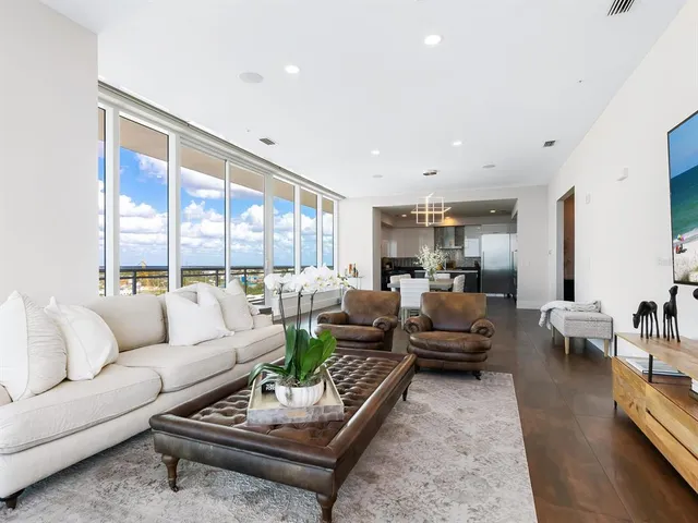 a bedroom with a large bed and a night stand