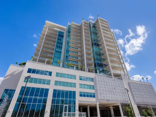 a large kitchen with a table and chairs