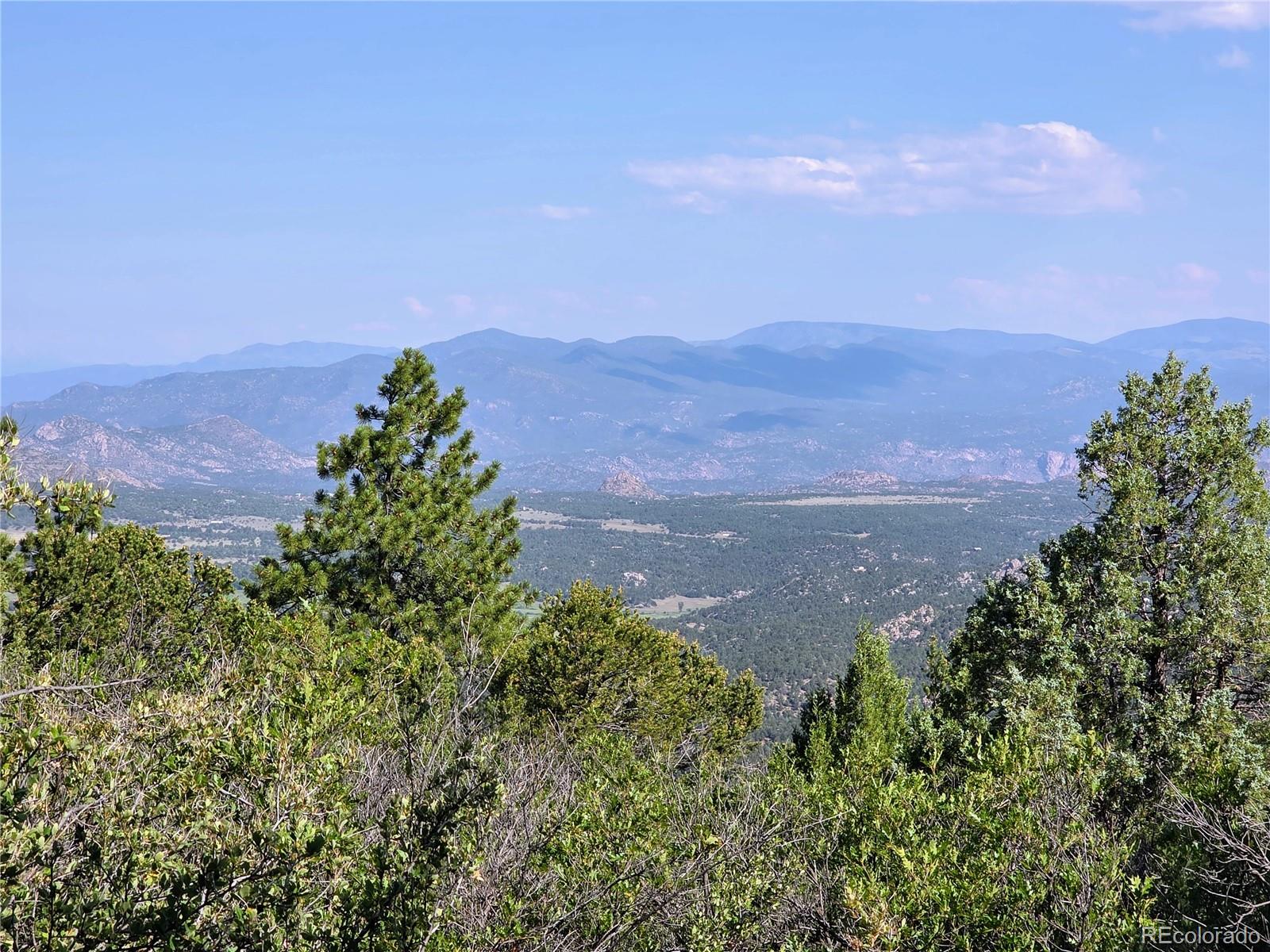 781 Ridgeway Road Cotopaxi, CO 81223 - Photo 7 of 42 an aerial view of a house with a yard and mountain in the back