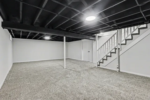 a view of an empty room with stairs
