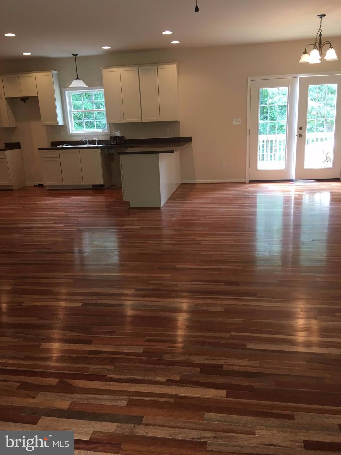 23093 Monrovia Road Orange, VA 22960 - Photo 15 of 15 Living Room leading into Kitchen WOOD FLOORS