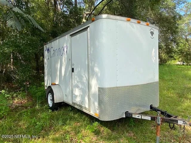 a view of a backyard with swimming pool