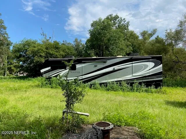 an outdoor space with furniture and garden