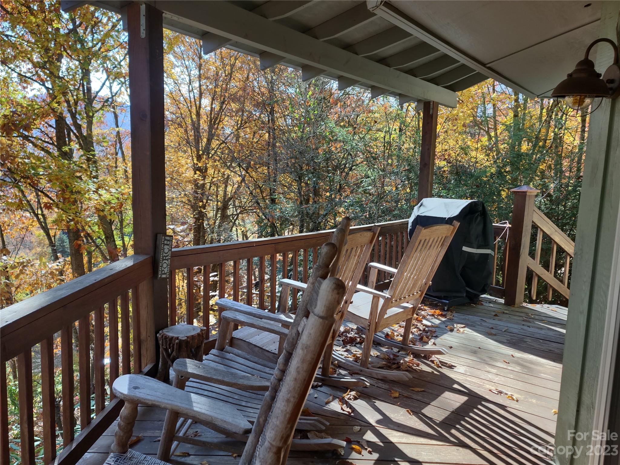 33 Rountoit Road Waynesville, NC 28786 - Photo 39 of 46 a view of balcony with wooden floor and outdoor seating