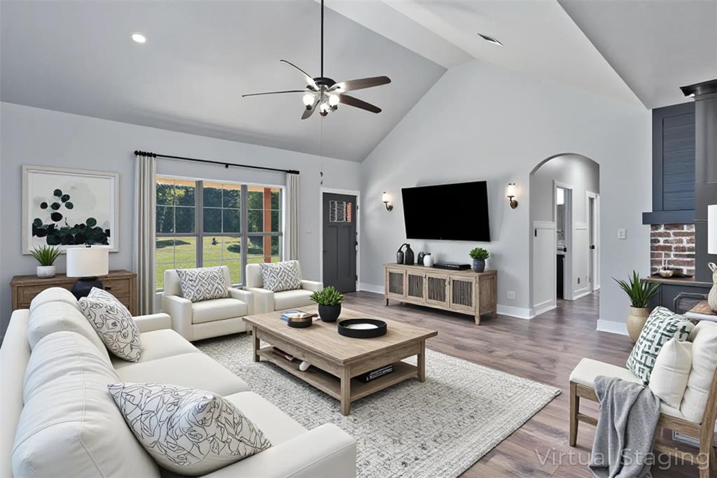 550 Linton Bellevue Road Benton, LA 71006 - Photo 9 of 37 Living room featuring ceiling fan, high vaulted ceiling, wood finished floors, and arched walkways