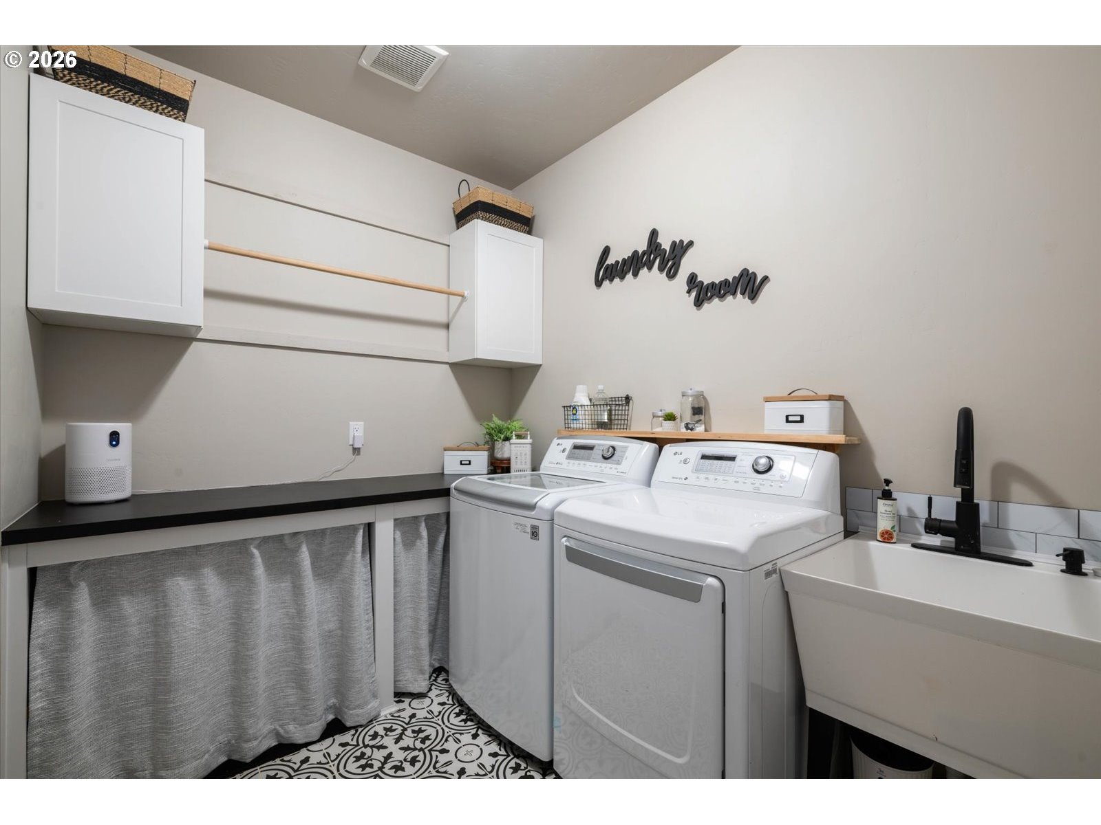224 Rome Street Boardman, OR 97818 - Photo 11 of 23 a utility room with cabinets