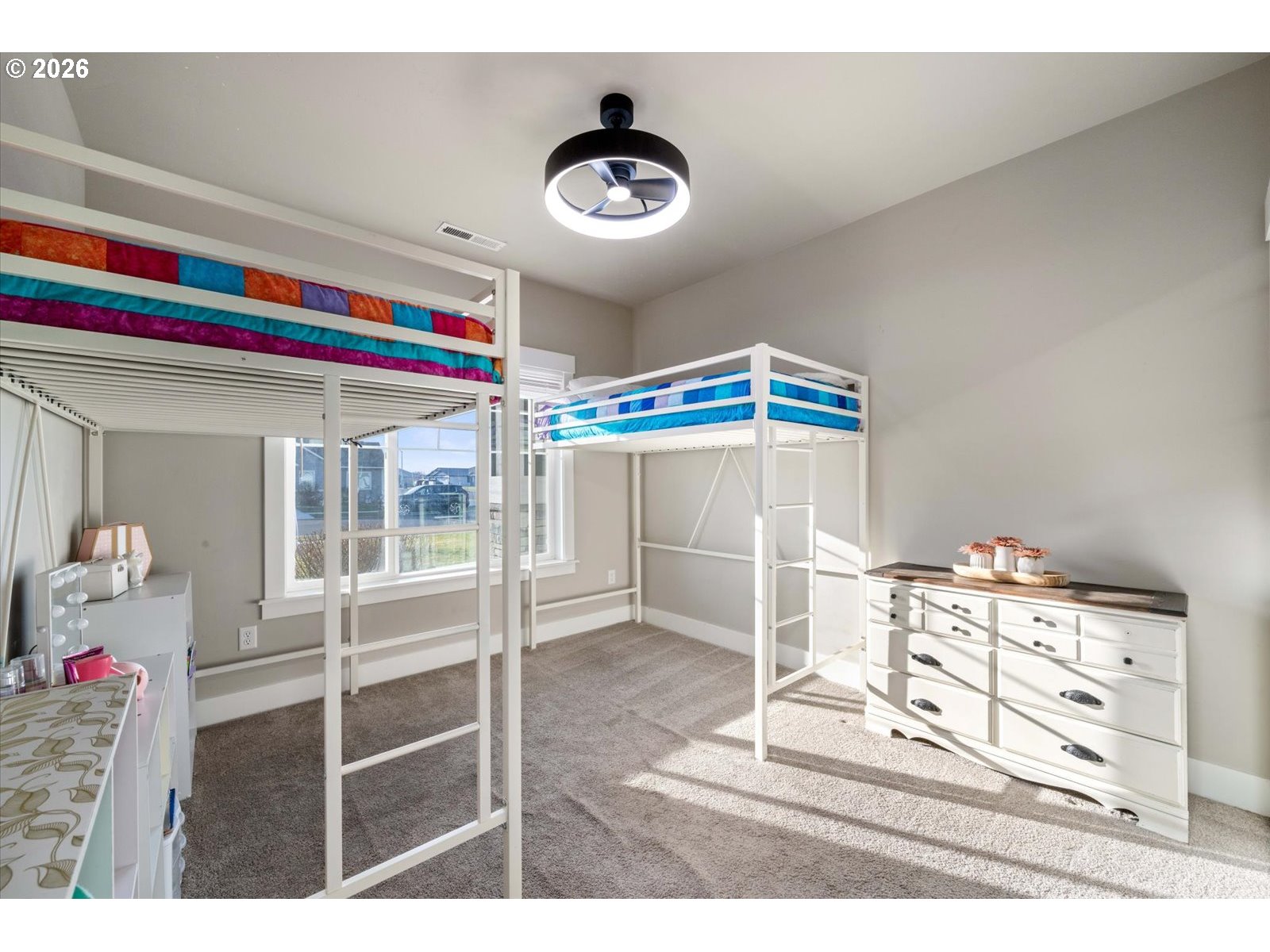 224 Rome Street Boardman, OR 97818 - Photo 16 of 23 a bedroom with a bed and a chandelier