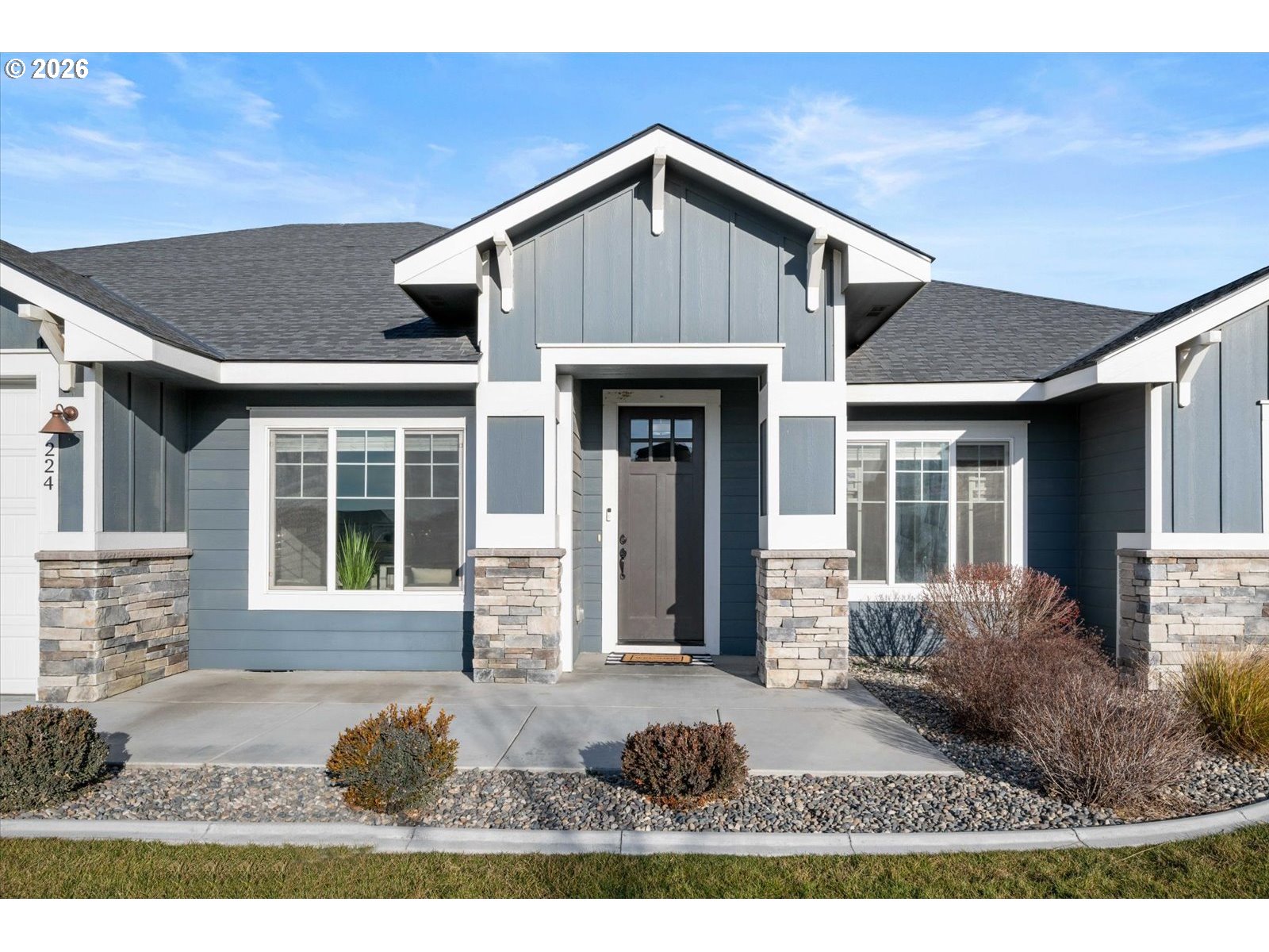 224 Rome Street Boardman, OR 97818 - Photo 2 of 23 a front view of a house with garden