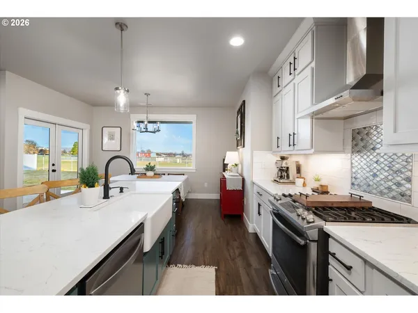 a kitchen with cabinets a sink and stove