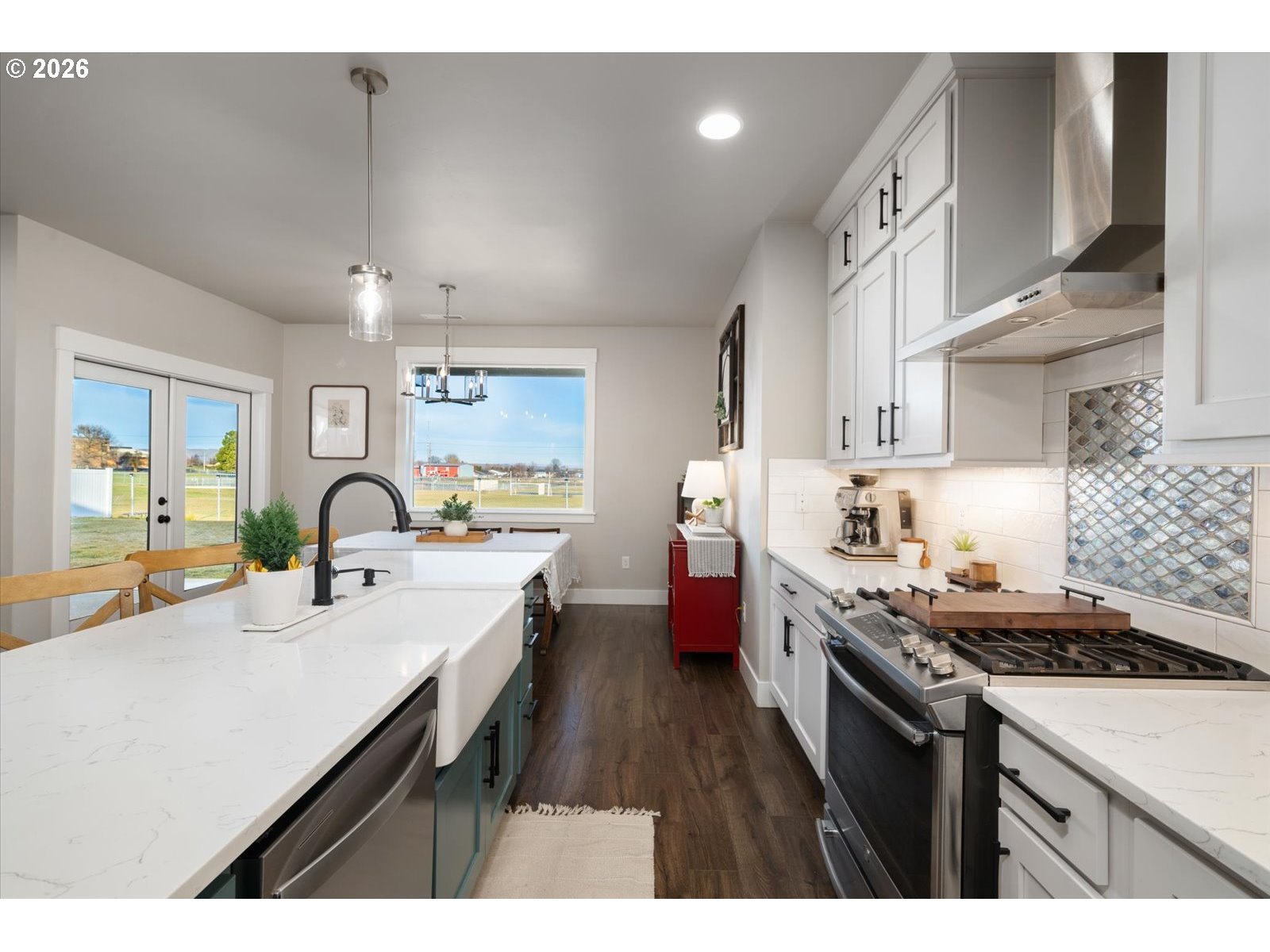224 Rome Street Boardman, OR 97818 - Photo 23 of 23 a kitchen with cabinets a sink and stove