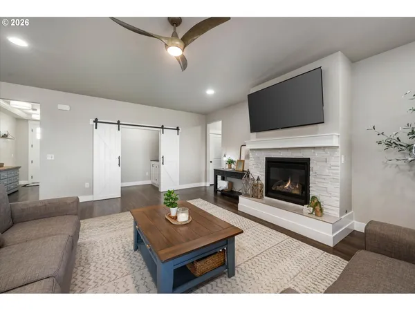 a living room with furniture and a fireplace